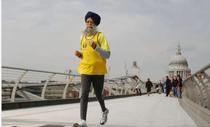 Fauja Singh, the 100-year-old marathoner, running and demonstrating excellent, upright posture.